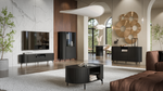 Dark round ribbed coffee table with open storage and gold-tone legs