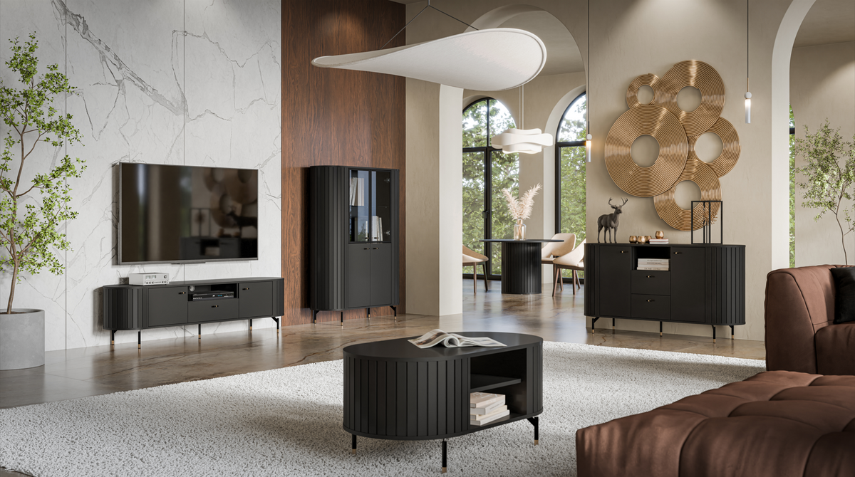 Dark round ribbed coffee table with open storage and gold-tone legs