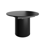 Extendable round table with black tabletop and ribbed pedestal base, side view