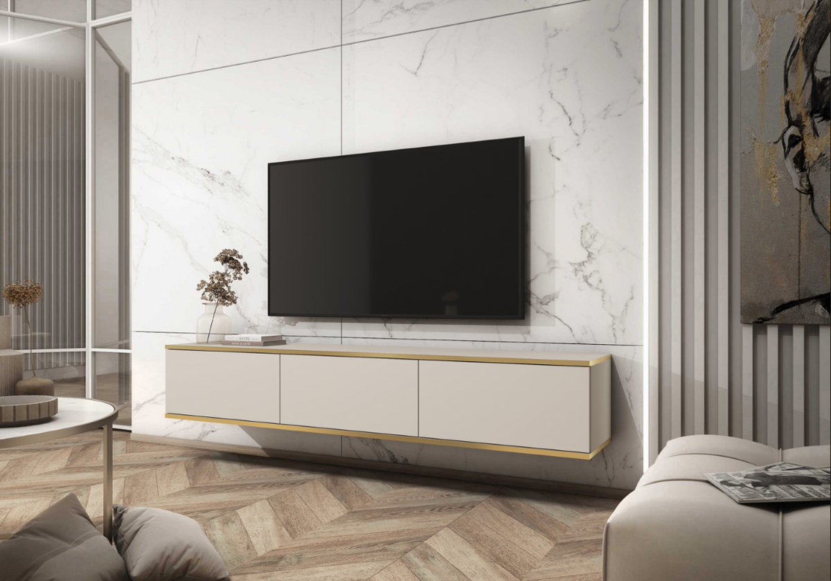 Light beige TV cabinet with gold trim under wall-mounted flat-screen TV