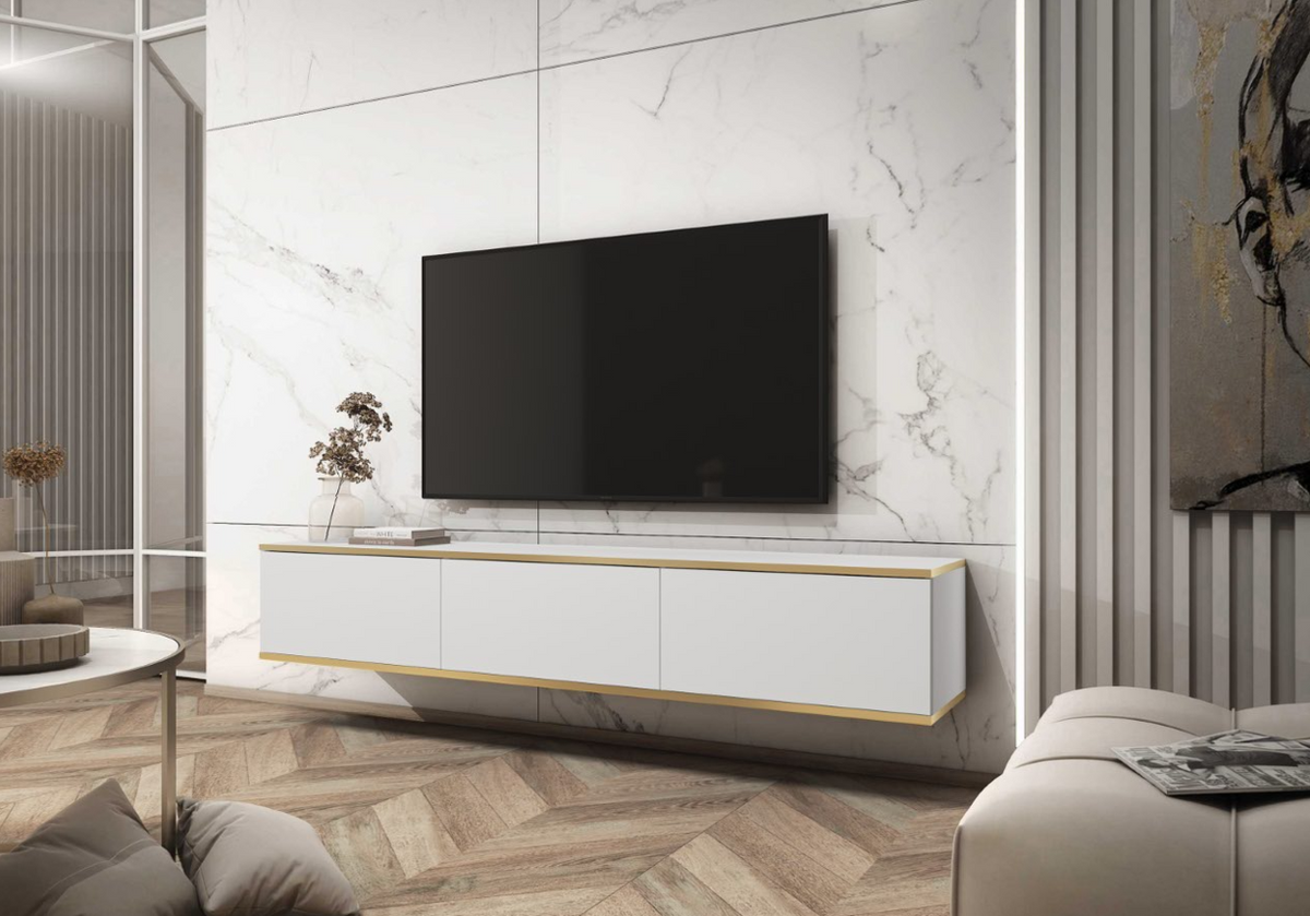 White TV cabinet with gold trim under wall-mounted flat-screen TV