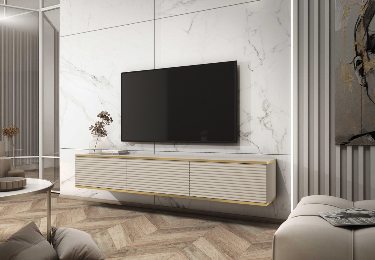 Beige ribbed TV console with two sliding doors and gold trim, low media storage unit.
