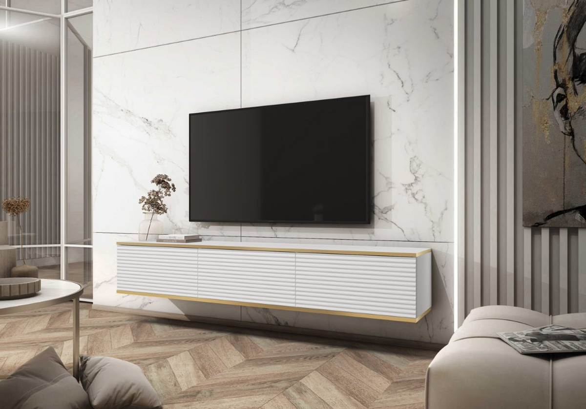 Black ribbed TV console with two sliding doors and gold trim, low media storage unit.
