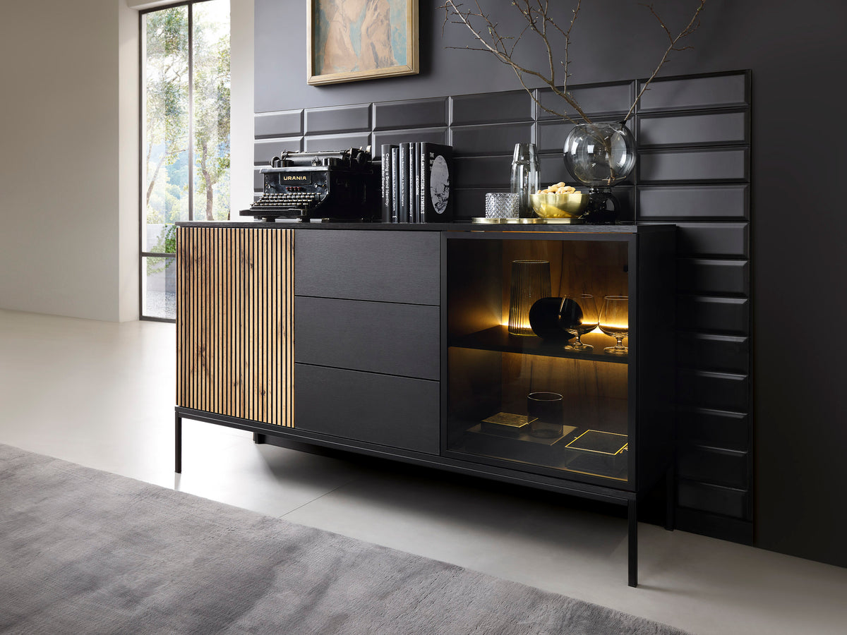 Black and oak sideboard with slatted drawer front and lit glass cabinet