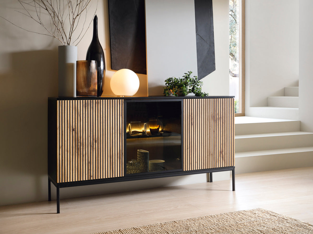 Black sideboard with glass center and vertical slat fronts, three-door storage
