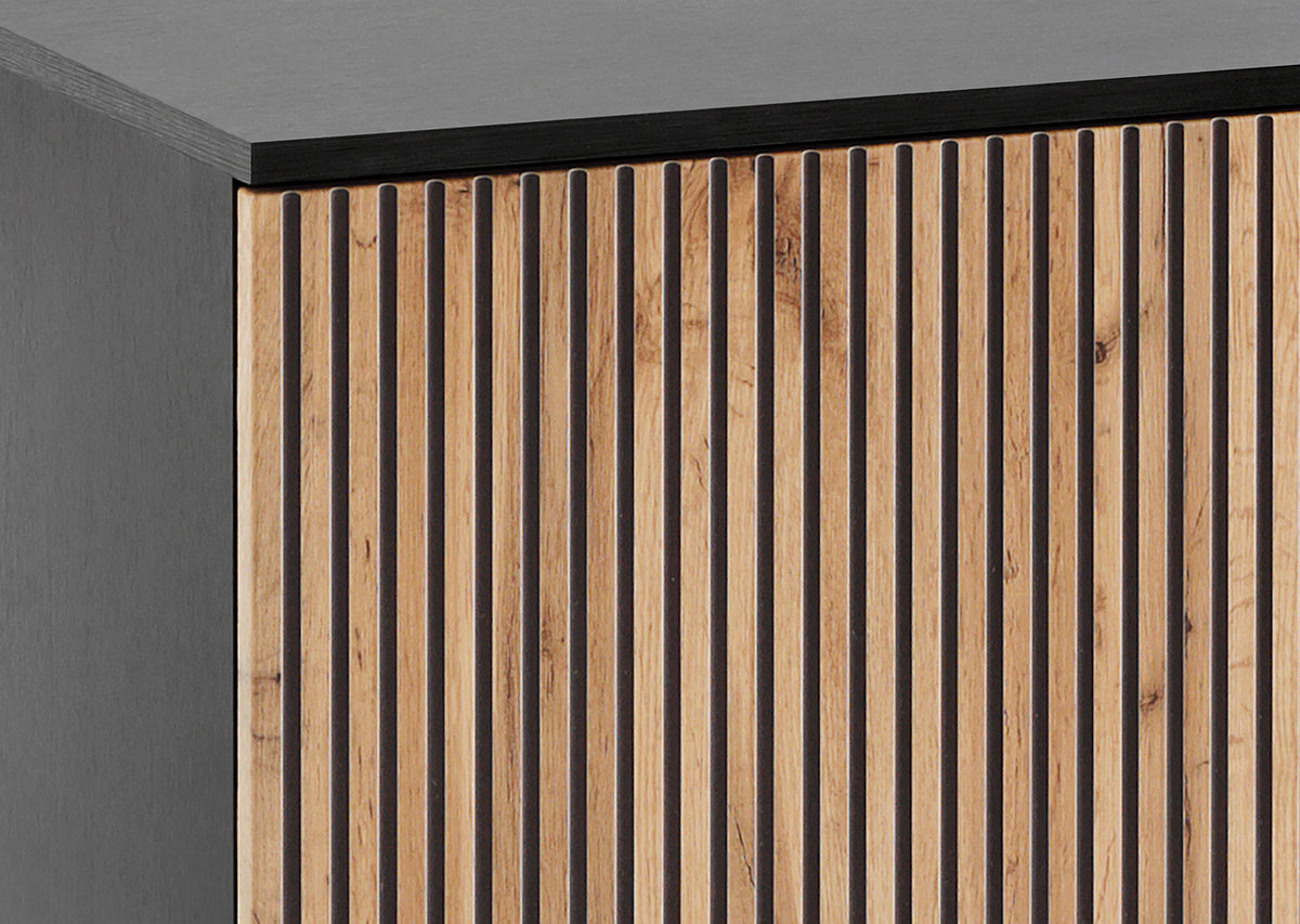 High display cabinet corner detail with vertical slatted wood doors and black trim