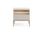 White bedside table with ribbed vertical drawer front and glowing open shelf