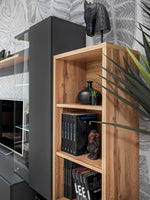 Wood and gray media cabinet with glass shelves and vertical book storage section