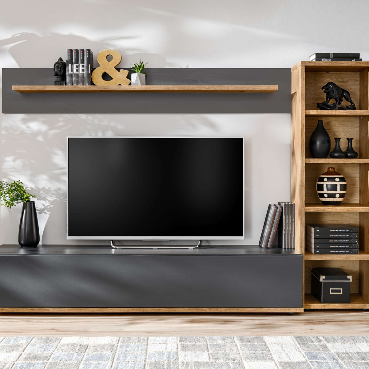 Media wall unit set with TV in center, open shelves on the right, console below