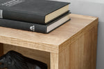 Anthracite media wall unit corner detail with stacked shelves and book decor