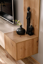 Corner media wall cabinet with open top ledge, wood box base, and vertical slat panel