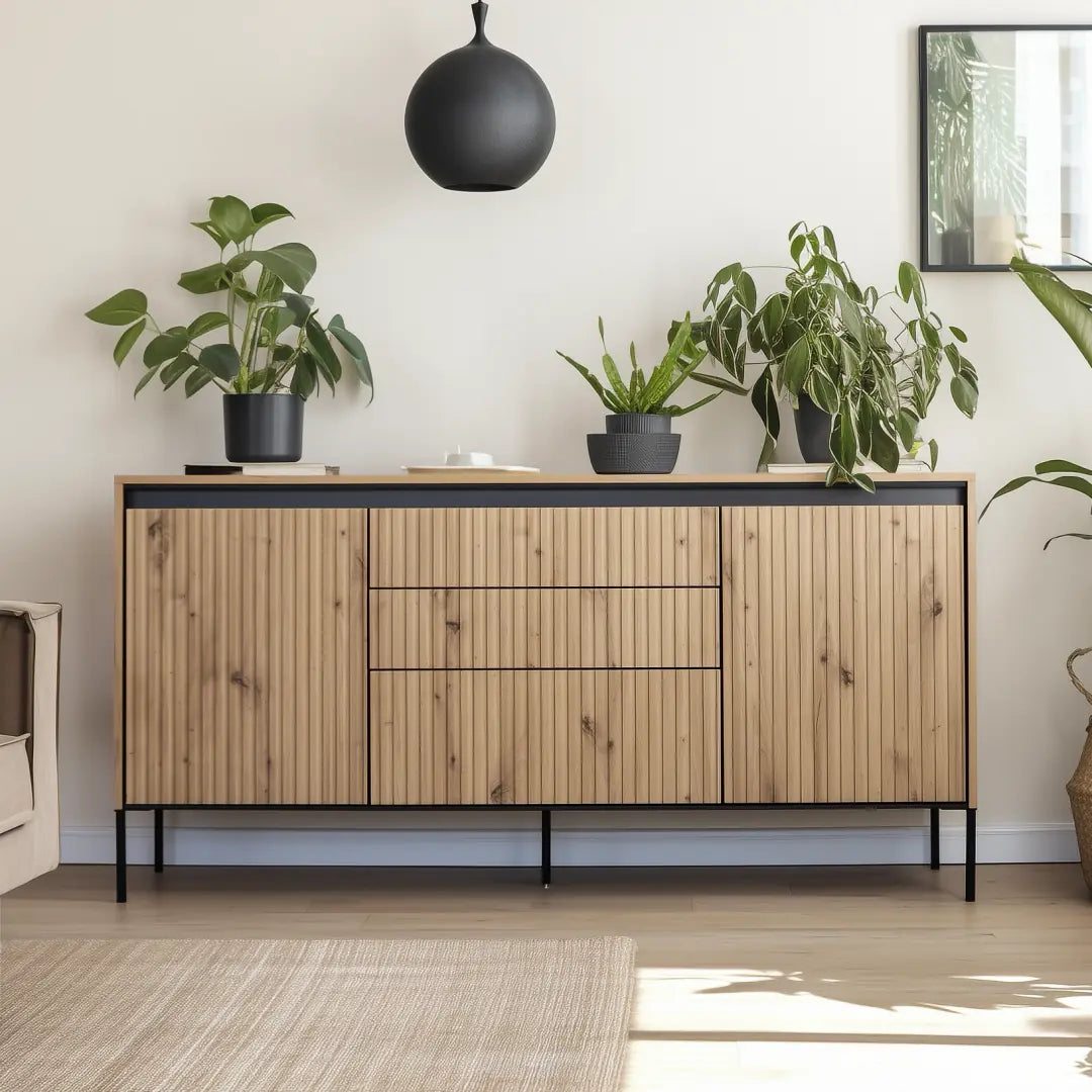 Wood 4-door sideboard with ribbed panels, center drawer, and black legs.
