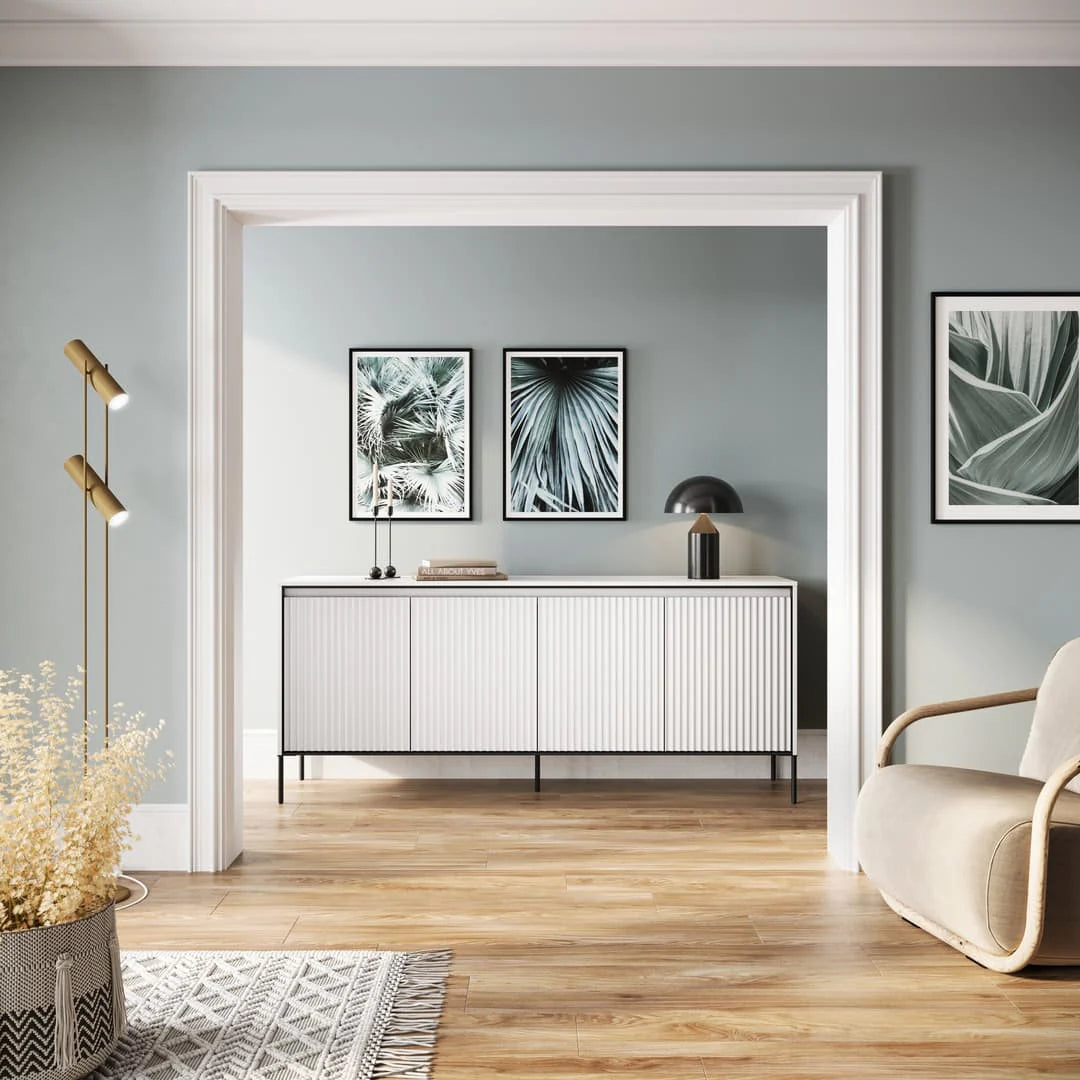 White 4-door sideboard with fluted doors and black metal legs.