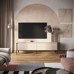 Long TV cabinet in light beige with vertical ribbed doors and metal legs