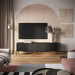 Long TV cabinet in dark charcoal with vertical ribbed doors and metal legs