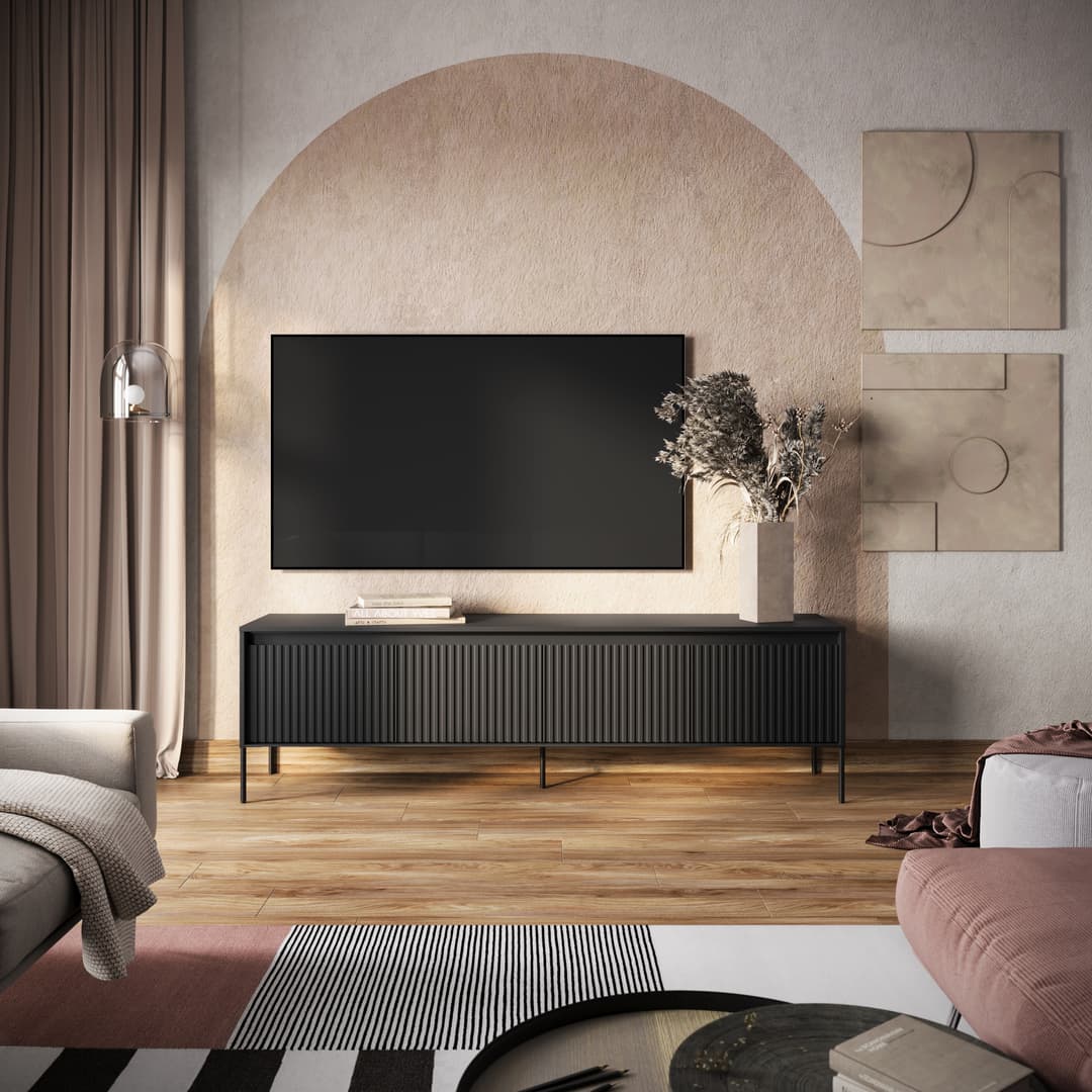 Long TV cabinet in dark charcoal with vertical ribbed doors and metal legs