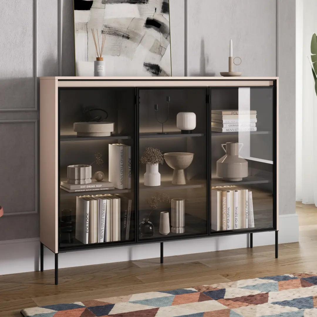 Beige display cabinet with double glass doors and interior shelves, on thin legs