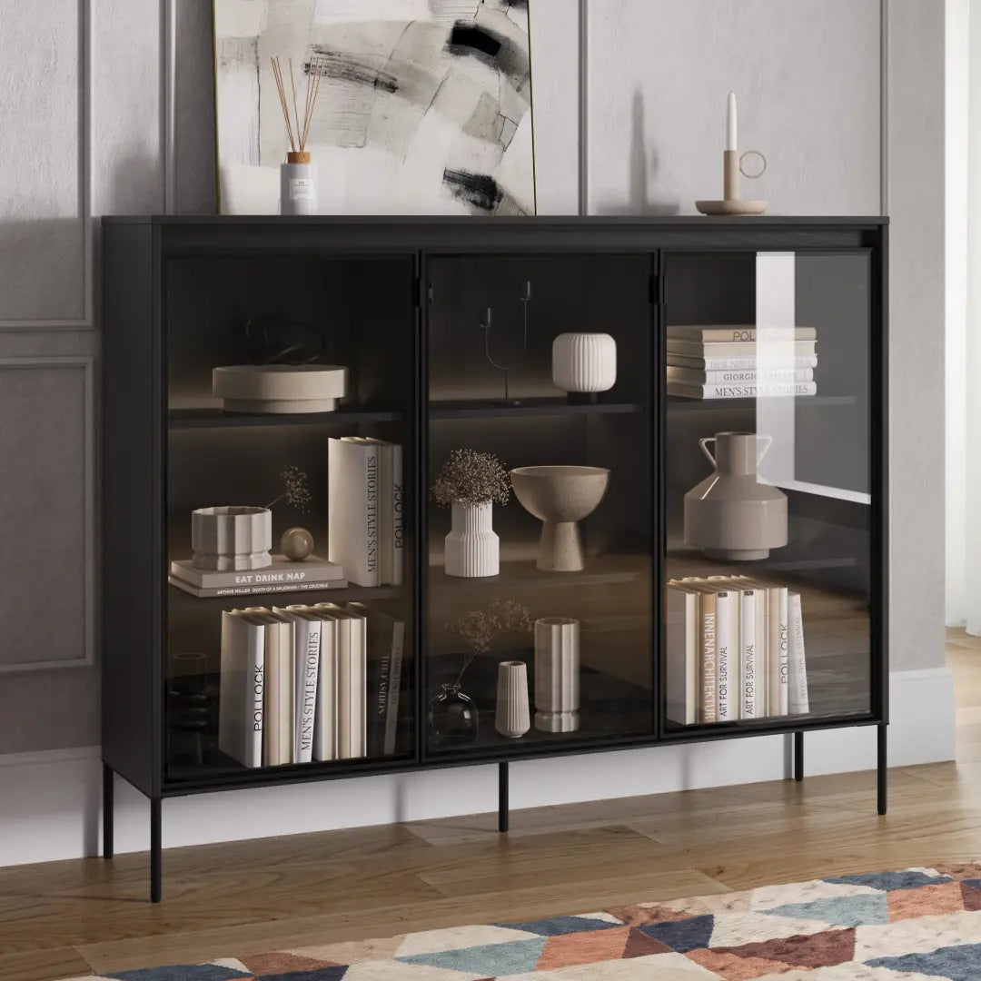 Black display cabinet with two glass doors and multiple interior shelves, on slim feet