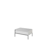 White matt coffee table with ribbed front panel, top surface, and slim metal legs.
