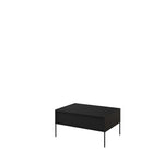 Black coffee table with ribbed front panel, top surface, and slim metal legs.