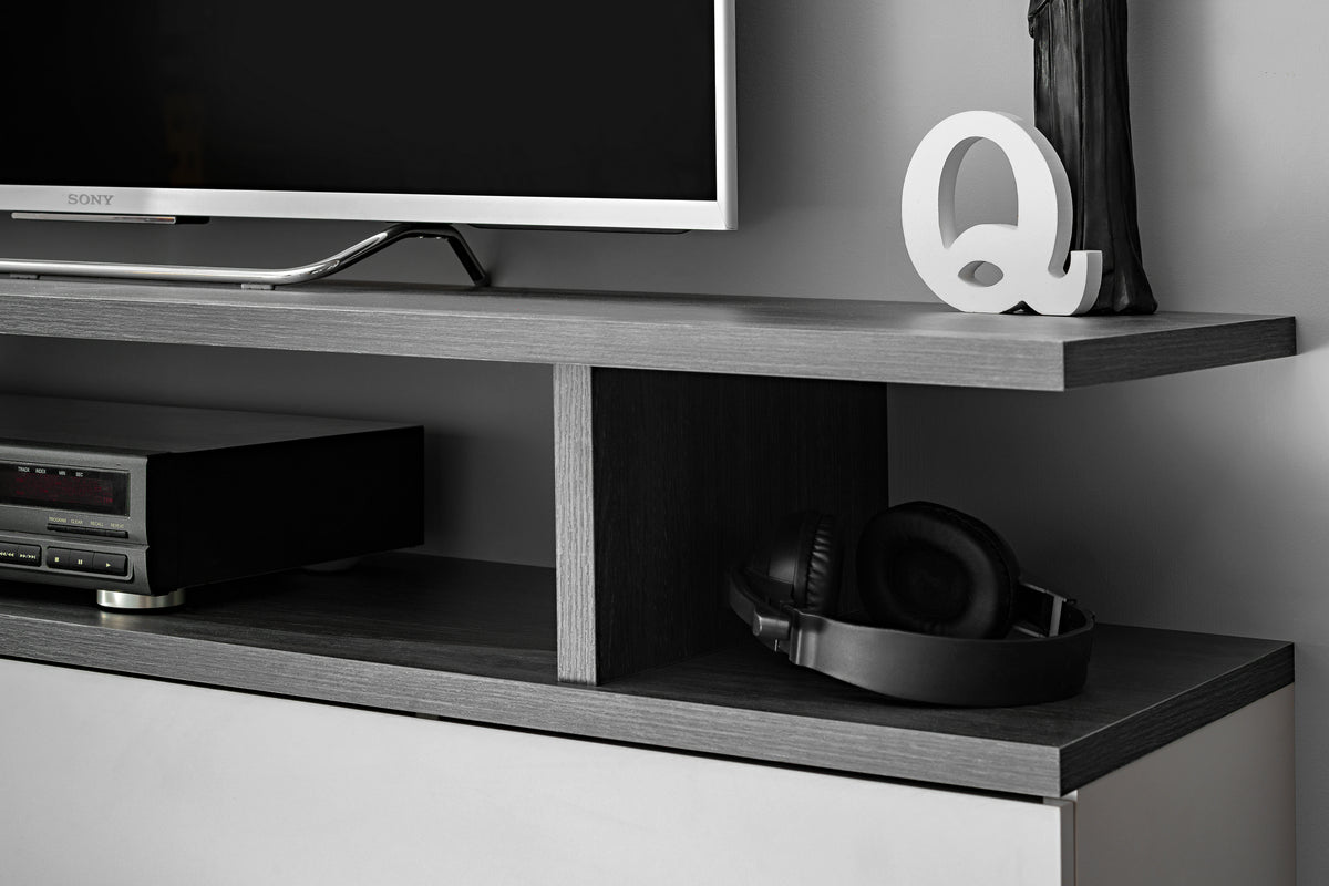 Media wall unit with open shelves, dark side panels, and a speaker and AV devices