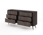 Dark wooden chest of drawers with six drawers and central vertical panel, tapered legs