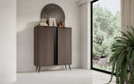Dark wood highboard cabinet with two doors, vertical ribbed panel, and slim legs.