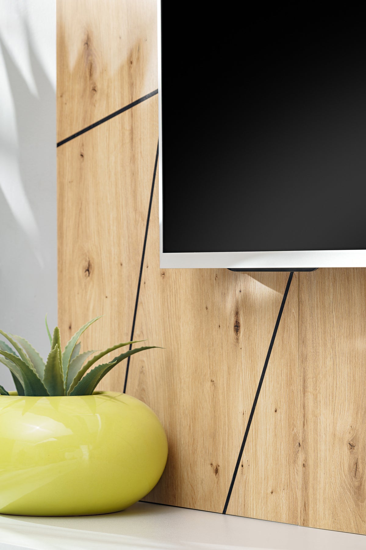 Givi media wall unit with wood paneling, TV screen inset, and light gray base