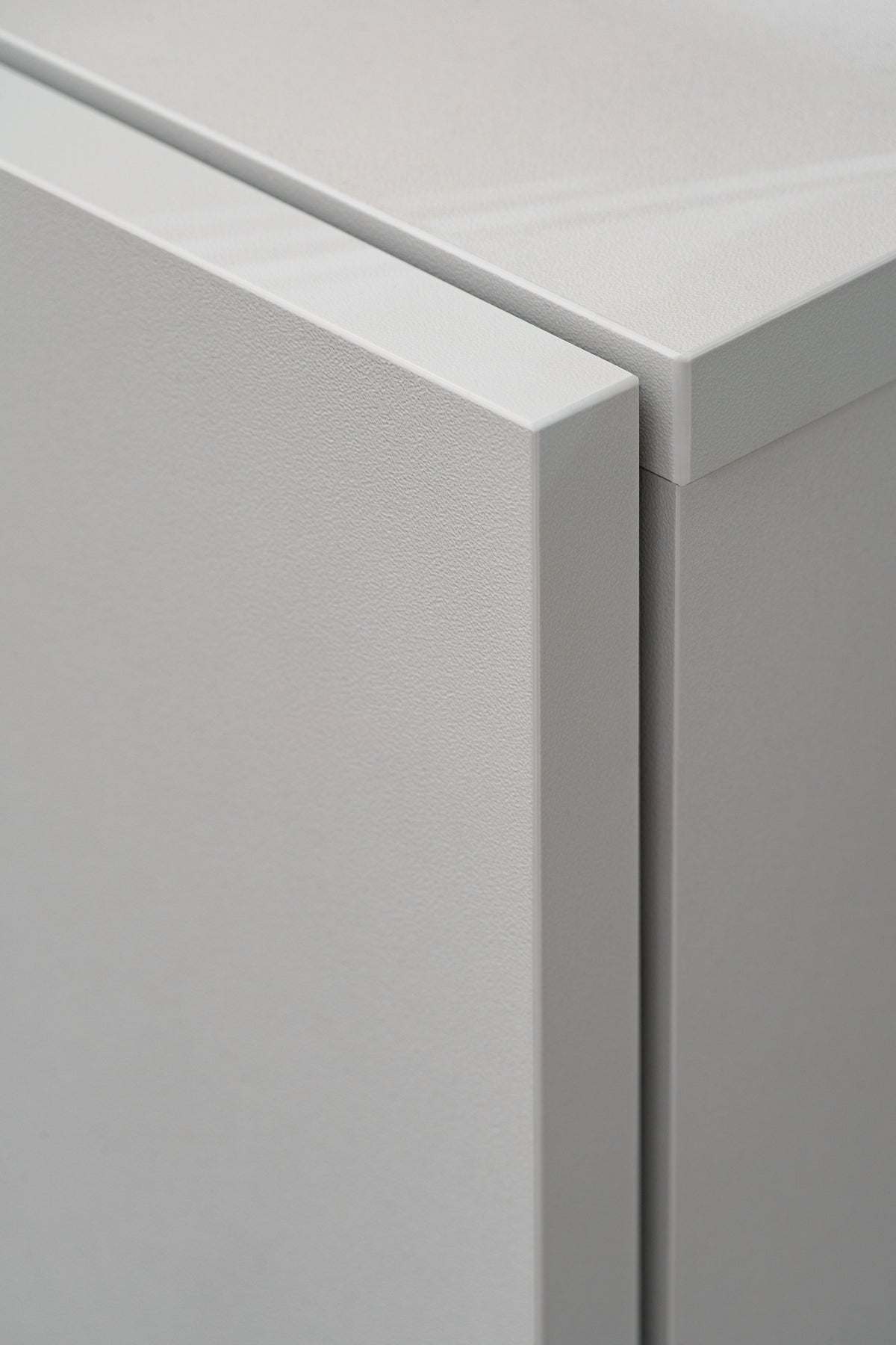 Media wall unit corner with light gray frame and smooth white top edge