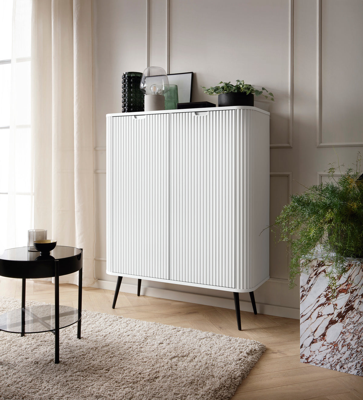 Cashmere highboard cabinet with vertical ribbed door fronts and tapered legs