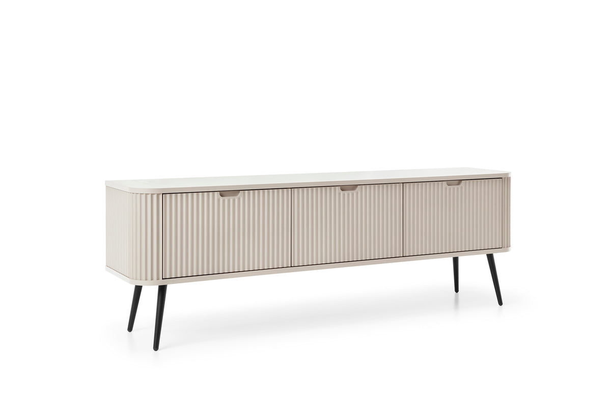Mila TV cabinet with cream-white fluted front, two drawers, and slim dark legs.