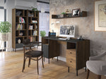 Tall dark wood bookcase with multiple open compartments for books and decor