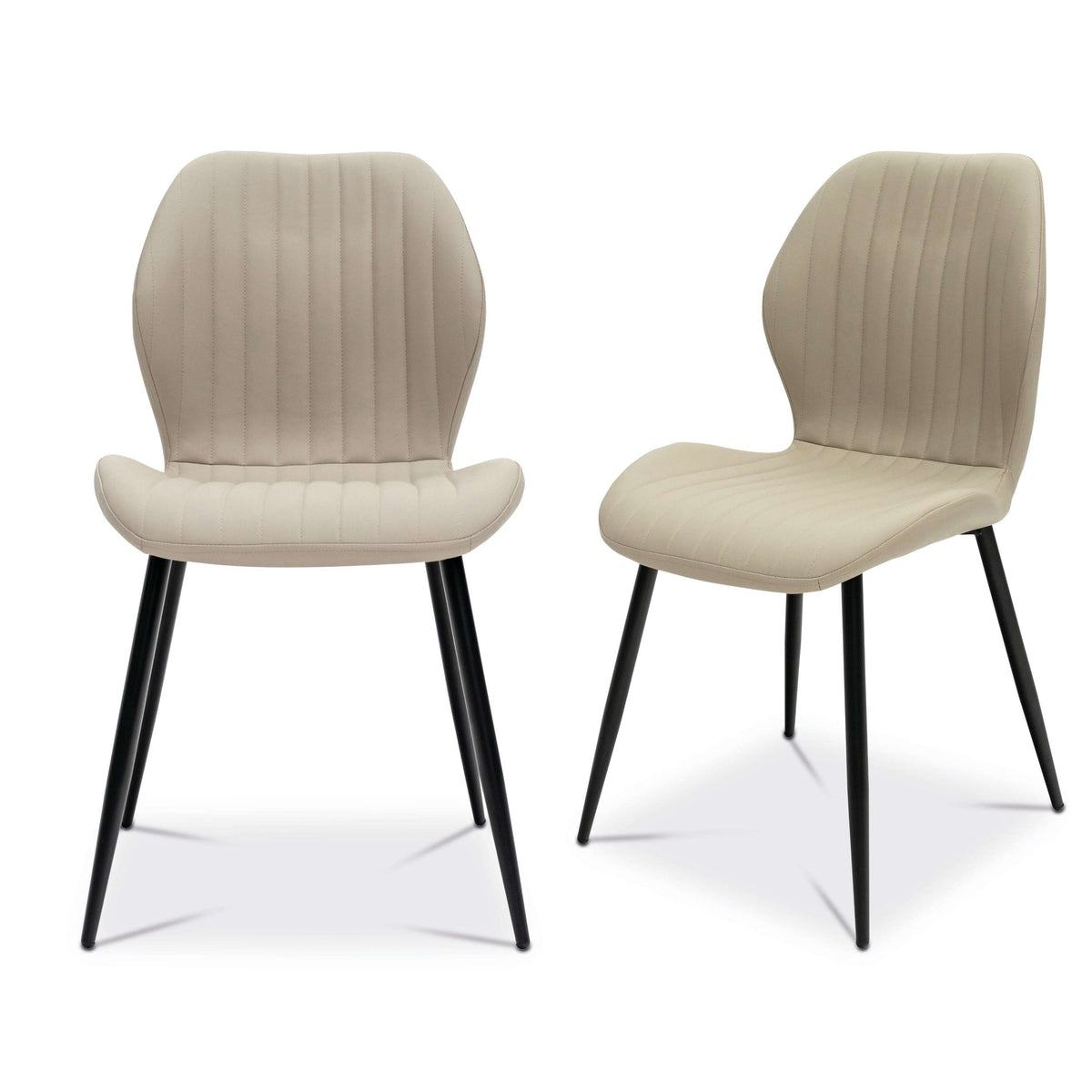 Set of two beige faux leather dining chairs with ribbed backs and black metal legs