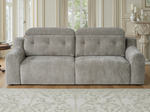 Light gray electric sofa with tufted back and seat cushions, wide arms, front view.