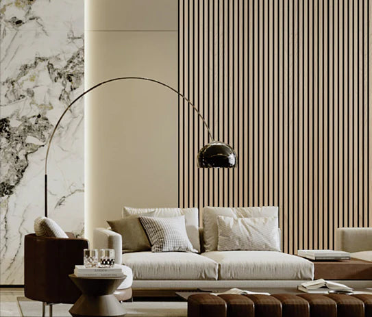 Acoustic wall panel with vertical natural oak slats behind a sofa