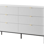 Ridge chest of drawers in light grey with vertical ribbed fronts and brass-tone bar handles.